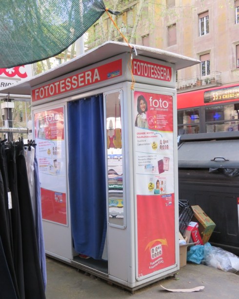 The fototessera booth, where we go for ID pictures, and where shoppers can slip in to try on clothes. Note the handy location next to overflowing trash bins. 