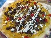 Flatbread "pizza" with harissa hummus, chili spicied lamb, roquito peppers, and feta. Yum!